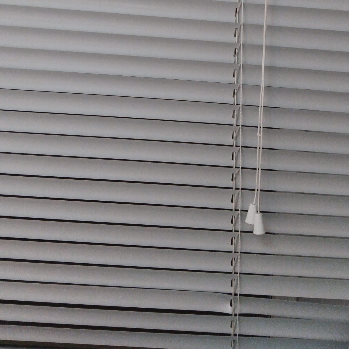 Horizontal blinds with a pull cord that afford pulling and adjusting light levels.