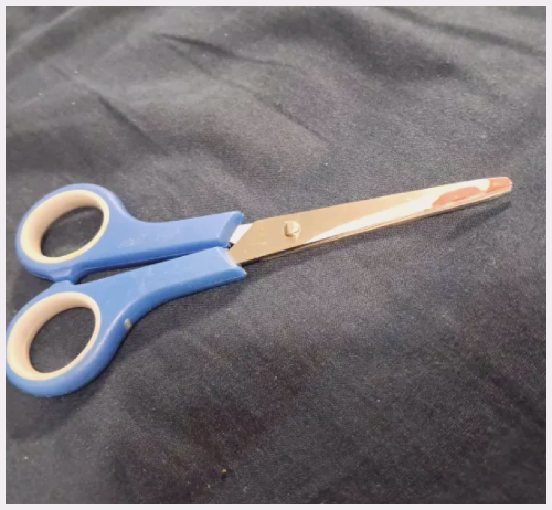 Closed blue scissors.