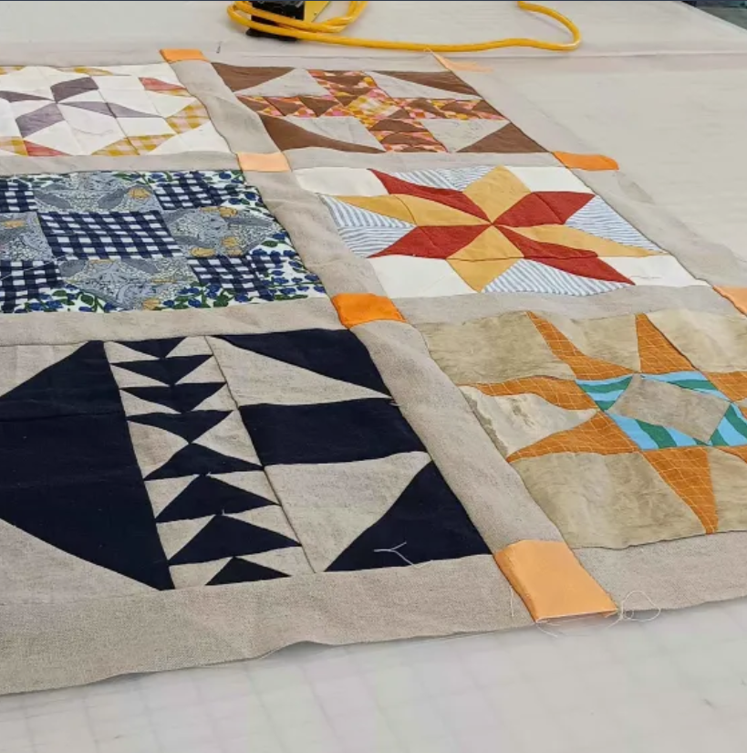 Dyed cloth in patterns hand-done by a student in the AA wing.